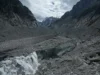 Changement Climatique: Plus de 12000 milliards de Tonnes de Glace perdues… Des bâches recouvrent la grotte de glace du glacier de la « Mer de Glace » pour empêcher sa fonte, à la station de Montenvers à Chamonix, en France, samedi 5 septembre 2026 | Photo: AP